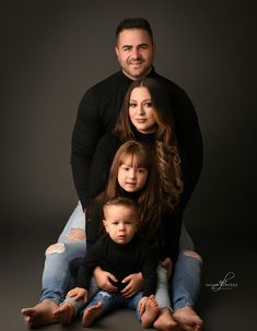 an image of a family posing for the camera