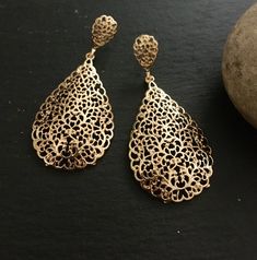 "These are lovely dangling chandelier style earrings in gold .an vintage style gold  teardrop dangle earrings  These are an Indian earrings that could be worn by both traditional and an western attire. This Unique jewellery is designed and crafted at Abi CreatioNzs Abi CreatioNzs is the place for anyone who Is in lookout for a latest trend with an ethnic touch.  We at Abi CreatioNzs offers a great range of Indian Ethnic jewellery's. We are strongly committed to  providing our customers  some uniquely handcrafted products with utmost satisfaction.  Note: The product shipped will be same as shown in the picture however, actual colours may vary slightly from those shown due to lighting in the photography Pls note The shades of gold / silver  may vary slightly. We do not accept any returns or Elegant Festive Teardrop Earrings, Bohemian Gold Chandelier Earrings With Pierced Style, Bohemian Gold Chandelier Earrings, Gold Bohemian Chandelier Earrings For Wedding, Gold Drop Chandelier Earrings Gift, Gold Teardrop Pendant Earrings For Party, Bohemian Teardrop Yellow Gold Earrings, Bohemian Yellow Gold Teardrop Earrings, Yellow Gold Teardrop Chandelier Earrings