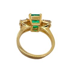 14K yellow gold ring with emerald and diamond.    Sophia D by Joseph Dardashti LTD has been known worldwide for 35 years and are inspired by classic Art Deco design that merges with modern manufacturing techniques. Gold Tsavorite Emerald Ring For Formal Occasions, Yellow Gold Emerald Ring With Baguette Cut, Formal Gold Emerald Ring With Tsavorite, Gold Baguette Cut Emerald Ring, Formal Gold Emerald Ring With Three Stones, Gold Emerald Ring With Baguette Cut And Prong Setting, Luxury Gold Emerald Ring With Three Stones, Fine Jewelry Gold Emerald Ring Baguette Cut, Fine Jewelry Gold Emerald Cut Emerald Ring