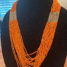 Seed Bead Necklace Multicolored Long Seed Bead Necklace With Gold Accents & Adjustable Lobster Claw Clasp With Extender. Beads Are Of Varying Lengths And Diameters For More Texture With Longest Strands 14’’ (Before Extender). Orange Multi-strand Colorful Beads Jewelry, Orange Necklaces With Large Beads For Party, Orange Polished Beads Necklace, Orange Beaded Long Necklace, Orange Party Necklaces With Large Beads, Handmade Multi-strand Orange Beaded Necklaces, Adjustable Orange Beaded Necklace With Faceted Beads, Orange Beaded Necklaces For Party With Round Beads, Orange Multi-strand Beaded Necklaces