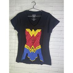 Up For Grabs Is A Brand New Without Tag Dc Comics Wonder Woman Graphic Print V-Neck Short Sleeve Tee T-Shirt Women's Juniors Size Large. Never Worn Or Used. Measurements Laying Flat Are Included In Photos, Please Compare Them To Your Own For Proper Fit! Please Refer To All Photos. Ask Any Questions Prior To Purchasing. Thanks! Black T-shirt With Graphic Print For Comic-con, Black Pop Culture T-shirt For Comic-con, Black T-shirt For Comic-con, Character Print Graphic Tee For Comic-con, Pop Culture Tops For Comic-con And Fan Conventions, Pop Culture Graphic Print Tops, Comic-con Character Print Short Sleeve Tops, Comic-con Character Print Graphic Tee, Cotton Tops For Comic-con Fan Merchandise