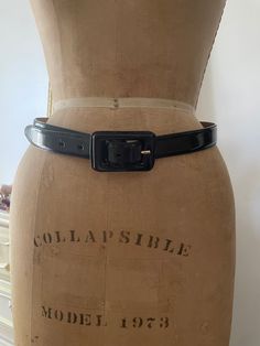 To view the full description for this vintage item, please expand the listing 🌸 Vintage Brooks Brothers dress belt, made in Italy of a high quality glossy black leather (not patent leather, just a high shine.  Size marked M Smallest setting 28" Largest: 32" Total length not including buckle: 36" Excellent vintage condition with barely any signs of wear, presents beautifully! ♥️ All sales on preowned vintage are final, no returns or order cancellations. Feel free to reach out with any questions prior to purchase- happy to help! Vintage Black Belt With Antique Buckle, Designer Fitted Black Belt, Vintage Black Belt Buckle With Antique Design, Black Formal Belt With Antique Buckle, Formal Black Belt With Antique Buckle, Formal Fitted Black Belt Buckle, Vintage Belts With Removable Buckle For Parties, Chic Black Belt With Antique Buckle, Vintage Fitted Belt For Formal Wear