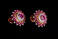 Large Burmese ruby studs set with unheated rubies and diamonds in 22k. This is a vintage style, built on traditional Burmese designs that also show Indian influence. The natural rubies weigh 2.8ctw in all, a pinkish red most visible at the two centre stones, and a recognisable Burmese hue. These studs are an ornate classic 'royal' style, the scalloped details seen in cherished antiques everywhere. The stones cluster in a two tone gold body, white prongs follow white diamonds, yellow prongs follow rubies, following traditional craftsmanship. These larger studs sit well on the ears through their screw-back ear posts. The studs come to 18mm by 15mm. The diamonds weigh 0.6ctw. All the jewelry photographed are of Burmese provenance, a wearable 'Mogok' decorum styled with both antique (ring) and Red Ruby Diamond Earrings For Wedding, Traditional 17 Jewel Diamond Earrings For Gift, Traditional Red Diamond Earrings, Traditional 17 Jewel Diamond Earrings For Anniversary, Traditional Diamond Earrings With Gemstone, Traditional Prong Set Diamond Earrings For Formal Occasions, Traditional Pink Earrings For Formal Occasions, Traditional Yellow Gold Diamond Earrings, Traditional Pink Ruby Earrings