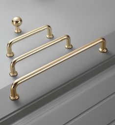 three brass handles on the side of a door