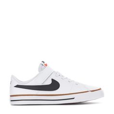 a white and black nike sneaker with an orange stripe on the side, in front of