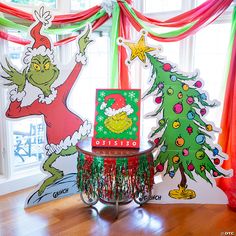 the grinch christmas tree has been decorated with tinsel and streamers for decoration