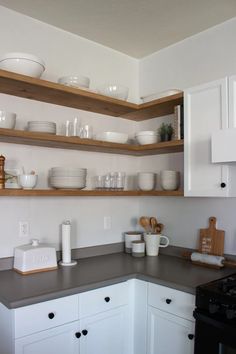 the kitchen is clean and ready to be used for dinner or desserts on the shelves