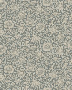 an old wallpaper pattern with flowers and leaves on the side, in shades of blue