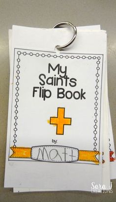 a clip book with the title my saints flip book written on it