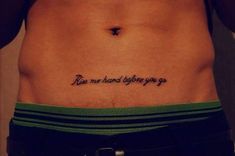 a person with a small tattoo on their stomach