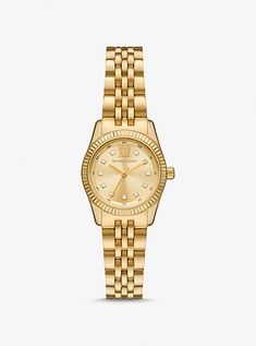 The Lexington watch exudes everyday glamour with its gold hue and sparkling pavé accents. Made entirely of stainless steel, this mini timepiece boasts a round face with a beveled topring and a matching bracelet strap. Slip it on to give both day and night outfits a dose of sophisticated charm. Womens Watches Gold, Hailey Bieber Rolex Watch, Jewerly Stacks Gold, Gold Bracelet Watch, Watch Women's Classy, Women Watches Classy Elegant, Michael Kors Watches Women, Michael Kors Watch Women's, Women Gold Watch