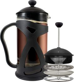 a french press coffee maker with its lid open next to it's holder and strainer