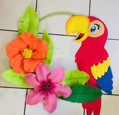 a colorful parrot and flower made out of paper