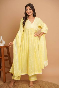 Lemon yellow three fourth sleeves Aliya cut gathered flare anarkali with gardenia fleur embroidery all over and lace detailing. Paired with a lace embroidered hem pant and lace embellished dupatta. - Aza Fashions Aliya Cut Dress Design, Aliya Cut Anarkali, Lemon Yellow Kurti, Yellow Suit Indian, Lemon Yellow Dress, Frock Suit, Yellow Anarkali, Yellow Kurti, Lace Suit