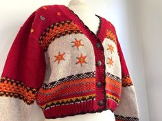 "Bright red and orange vintage le chateau cropped sweater. Amazing stitched snowflake/star details and ornate buttons. Interior tag reads \"100 % cotton, size medium. Hand wash cool water, lay flat to dry.\" Measurements: bust (armpit to armpit)- 22\" length- 20\"  sleeve (armpit to cuff)- 18\" Thanks for checking out wild mint vintage~" Red Buttoned Sweater For Winter, Red Sweater With Buttons For Winter, Red Winter Sweater With Buttons, Casual Cropped Sweater With Buttons For Winter, Cropped Buttoned Winter Sweater, Cropped Winter Sweater With Buttons, Winter Long Sleeve Cropped Sweater With Buttons, Fitted Red Sweater With Buttons, Red Knit Sweater With Buttons