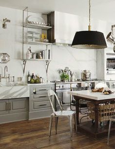 the kitchen is clean and ready to be used for cooking or dining room furniture, as well as other appliances