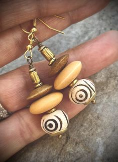 Tribal Boho Earrings African Batik Bone and Brass Beads Bohemian Cream Jewelry With Ear Wire, Bohemian Cream Jewelry With Wooden Beads, Bohemian Wooden Beads Earrings In Natural Color, Bohemian Wooden Bead Earrings In Natural Color, Bohemian Natural Wooden Beads Earrings, Bohemian Earrings With Wooden Beads, Handmade Beige Beaded Bohemian Earrings, Handmade Bohemian Cream Earrings, Gold Bohemian Earrings With Wooden Beads