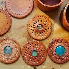 some brown and blue vases sitting on top of a table