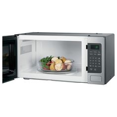 an open microwave with food in it