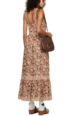 Floral pattern and lace trim throughout.Sweetheart necklinePleats at chest and backConcealed zip closure at backDetachable silk-blend crepe liningSupplier color: Brown/MixBody: 100% cotton. Lining: 76% acetate, 24% silk. Trim 1: 100% polyamide. Trim 2: 80% cotton, 20% polyamide.Made in Italy. Gucci Fitted Maxi Dress, Gucci Fitted Maxi Length Dress, Elegant Gucci Dress For Summer, Chic Lace Trim Maxi Dress, Fitted Silk Gucci Dress, Spring Silk Gucci Dress, Fitted Gucci Silk Dress, Chic Sleeveless Gucci Dress, Chic Gucci Dresses For Spring