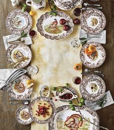 an overhead view of a table setting with plates and silverware on top of it