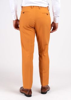 With a mustard-hue and stretch cotton fabric, you'll feel comfortable and stylish all day long in this unique custom made pants. Stand out and enjoy the compliments! Fitted Orange Elastane Bottoms, Fitted Orange Straight Pants, Fitted Orange Ankle-length Pants, Fitted Mustard Bottoms For Workwear, Mustard Fitted Bottoms For Workwear, Fitted Brown Cotton Pants, Tailored Brown Cotton Pants, Mustard Cotton Pants For Fall, Fitted Orange Cotton Pants