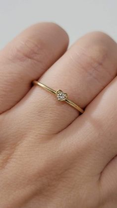 Diamond Heart-Shape Ring, Tiny 2MM Diamond Ring Women, Dainty Minimal Diamond Ring, Promise Ring, 14k Gold Stackable Ring, White, Rose Gold  Made in NYC - Custom Gold Color: Rose Gold, Yellow Gold, White Gold, in 14k  - Shank Width: 1.3mm - Diamond Shape: heart shape  - Number of Stones: 1 - Diamond Size: 2.2 mm - Total CTW:0.04 Ctw   - Diamond Color-Clarity: G-H / SI - Setting Type: Prong Setting  - Finish: high polish  We use only CONFLICT-FREE MINED DIAMONDS. This ring can be made in any ring Heart Shaped Single Diamond Fine Ring, Heart Shaped Single Diamond Ring Fine Jewelry, Heart Shaped Single Diamond Ring, Fine Jewelry Heart Shaped Single Diamond Ring, Rose Gold Stackable Heart Ring In Fine Jewelry Style, Valentine's Day Single Diamond Ring In Fine Jewelry Style, Stackable Rose Gold Heart Ring Fine Jewelry, Tiny Heart-shaped Ring For Anniversary, Valentine's Day Heart Ring With Single Diamond