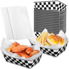 two baskets filled with food sitting next to each other on top of a white table