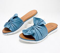 These leather sandals provide the convenience of a slip-on style wrapped up with a beautiful twisted bow. A small hidden gore adds additional adjustability, making this your go-to slide of the season. From Spring Step. Leather Slide Sandals, Leather Slides, Slide Sandals, Leather Sandals, Fashion Shoes, A Small, Leather Upper, Slip On, Sandals