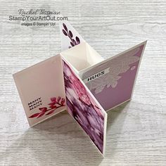 an origami card holder is open on a table with the inside folded up