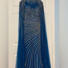 Beautiful Blue Gown With Long Flowy Straps Luxury Blue Floor-length Gown, Luxury Blue Evening Dress With Sweep Train, Luxury Fitted Blue Gown, Luxury Blue Party Gown, Luxury Blue Evening Dress For Gala, Luxury Blue Dress With Sweep Train, Luxury Fitted Blue Evening Dress, Luxury Blue Evening Dress, Glamorous Blue Gown For Evening