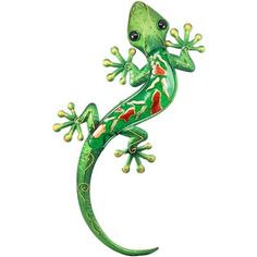 a green lizard with red spots on it's back legs and tail, standing upright