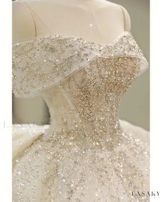 the back of a wedding dress with sequins on it