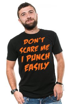 "Halloween Costume Funny T shirt Don't Scare Me I Punch Easily Funny Halloween T shirt Falls T shirt Halloween Party T shirt 100% halloween hit t-shirt.Cool and savage Halloween shirt. This ULTRA COTTON UNISEX T-shirt is made of Pre-shrunk 100% cotton, 6.1-ounce. * Seamless double-needle 7/8\" collar, Double-needle sleeves and hem, Taped neck and shoulders Our T Shirts and Hoodies are Printed by advanced technology Digital Printer on 100% Ultra Cotton tees and hoodies . We use waterbased textile Black Halloween T-shirt With Text Print, Halloween Black T-shirt With Text Print, Funny Halloween T-shirt For Streetwear, Funny Halloween T-shirt With Text Print, Funny Halloween Streetwear T-shirt, Funny Halloween Text Print T-shirt, Halloween Slogan T-shirt For Streetwear, Black Slogan T-shirt For Halloween, Halloween Novelty T-shirt For Streetwear