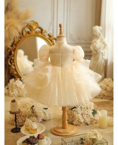 Get 10% off now! Buy unique champagne tulle toddler flower girl dress with ruffles blings at cheap price online. Free stable shipping and pro custom service since 2009. Gold Tulle Dress With Ruffles, Cream Tutu Dress With Ruffles For Baptism, Cream Ruffled Tutu Dress For Baptism, Elegant Cream Tutu Dress With Ruffles, Cream Princess Dress For Dress-up, Gold Ruffled Tutu Dress For Wedding, Cream Princess Dress With Ruffles, Tulle Pageant Dress With Ruffles For Wedding, Fitted Cream Princess Dress With Ruffles