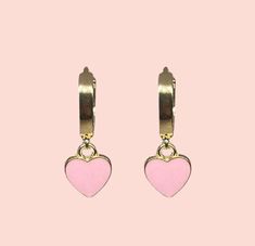 Gorgeous 18K Gold Plated Heart Huggies earrings with a baby pink enamel heart charm! Nickel free Apx hoop dimension (18K gold plated) - 16.5 x 14.5 x 13.5mm. Heart charm (enamel & alloy) - 12mm The perfect compliment to any outfit - treat yourself or a loved one to these special earrings. This item comes complete with a lovely pillow gift box Available in other colours from our Etsy store As with all jewellery, to keep in optimum condition, avoid showering in them and avoid any perfume contact. Pink Heart Charm Huggie Jewelry, Pink Heart Charm Hoop Earrings For Valentine's Day, Pink Hoop Earrings With Heart Charm For Valentine's Day, Pink Huggie Jewelry With Heart Charm, Pink Huggie Heart Earrings, Pink Heart-shaped Hoop Earrings For Gifts, Pink Heart Hoop Earrings For Gift, Pink Heart Hoop Earrings As Gift, Pink Dangle Hoop Earrings For Valentine's Day