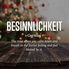 a wooden table with a christmas tree in the background that says, beinnlichket german