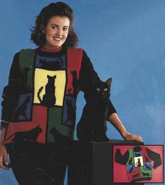 a woman standing next to a black cat in front of a box with pictures on it