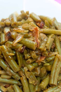 green beans with bacon in a white bowl