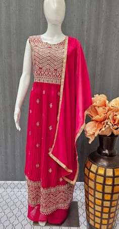 Get ready to make a statement at your next celebration with the Nyra Cut Suits Indian Party Wear Dress with Dupatta in Size 38. This ensemble features a palazoo bottom style and a glamorous fit that will make heads turn. The fashionable style and fashionable wear of this dress make it the perfect choice for any celebration. With its elegant ensemble and celebration glam, you'll be sure to make a lasting impression. Don't miss out on showcasing your celebration style in this unforgettable attire. Semi-stitched Party Sets For Diwali, Festive Semi-stitched Dress With Dupatta, Traditional Sets For Reception And Party Season, Embellished Party Wear Sets With Traditional Drape, Bollywood Style Dress For Eid Reception, Bollywood Dress For Eid Reception, Embellished Traditional Drape Set For Party, Embellished Party Set With Traditional Drape, Anarkali Kurta With Dori Work For Party