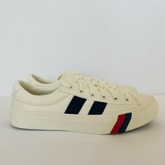 A Classic Cotton Canvas Upper With Red And Blue Powerstripe Details. Rubber Sole. Spot Wash, Air Dry Only. Unisex. Men Size 7 And Women Size 9. No Original Box. Sporty Striped Lace-up Sneakers, Striped Sporty Sneakers With Round Toe, Sporty Striped Sneakers With Round Toe, White Casual Sneakers With Signature Stripes, Casual White Sneakers With Signature Stripes, Casual Striped Low-top Sneakers, Casual Striped Sneakers For Spring, Casual Sneakers With Signature Stripes And Round Toe, Sporty Striped Low-top Sneakers