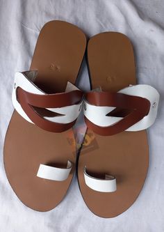 Beautifully designed African Leather sandals, Masai sandals, summer sandals, African sandals Made from leather Available in all sizes. Kindly, using the chart provided in the pictures above, check your foot size in EUR and US sizes before placing your order. Wholesale is available upon request at a discount price. Shipping is via DHL EXPRESS with a GUARANTEED delivery between 3-5 days worldwide. **BUY MULTIPLE ITEMS, PAY SHIPPING ONCE** FREE SHIPPING FOR ALL ADDITIONAL ITEMS IN YOUR CART Check o Leather Sandals With Single Toe Strap For Beach Season, Leather Open Toe Barefoot Sandals For Beach, Leather Open-toe Barefoot Sandals For Beach, Leather Barefoot Sandals For Beach, Leather Toe Post Sandals For Beach Season, Leather Closed Toe Barefoot Sandals For Vacation, Brown Leather Sole Sandals For The Beach, Leather Flat Flip Flops For Beach Season, Flat Leather Sandals For Beach Season