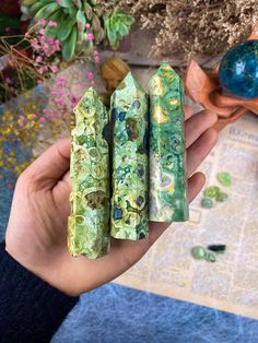 Production:- Purely handmadeGems:-Rainforest Jasper Point Rainforest Jasper towerShape:- pencil shapeStone Cut:- cut surfaceSize: -1:1.5in-2in 2:2in-2.8in 3:3in-4inPieces:- 1 PieceGive a random gift Rhyolite aka Rainforest Jasper, reconnects you to the life force within nature that resides all around you. It celebrates the joy of life, bringing awareness and joy for all thing that surround you. Let the earthy energy of a rhyolite crystal help you dissolve negativity and have a more positive outl Rainforest Jasper, An Attitude Of Gratitude, Crystal Vibes, Crystal Therapy, Cool Rocks, Crystal Healing Stones, Attitude Of Gratitude