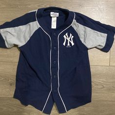 Never Worn New York Yankees Jersey Size Small Kids Casual Gray Tops For Playtime, Sporty Blue T-shirt For Playwear, Blue Tops With Letter Print For Playwear, Blue Letter Print Top For Playwear, Gray Sporty Tops For Playwear, Navy Cotton Playwear Top, Navy Cotton Tops For Playwear, Navy Short Sleeve Playwear Top, Navy Short Sleeve Top For Playwear