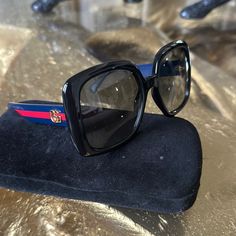 Gucci Women’s Sunglasses Black Square Frame With Navy And Red On Sides With Gucci Gold Logo These Are Super Lightweight And Comfy On Never Used Comes With Gucci Sunglasses Case Gucci Women, Gucci Sunglasses, Gucci Accessories, Gold Logo, Gucci Black, Black Square, Square Frame, Square Frames, Sunglasses Accessories