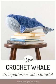 a knitted whale sitting on top of books with the text crochet whale free pattern