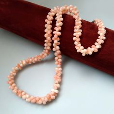 Thank you for visiting the SoChicFinds store - vintage and antique, costume and fine jewelry.  Pink bead necklace.  Gemstone: natural pink coral deep sea. size of the beads: from 5mm to 7.5mm. Length of the pink coral necklace: 39cm ~ 15.35 inches.   Weight of the gemstone necklace: 17.28 grams. Vintage Japanese coral jewelry.  Period: 1970s Feel free to ask questions, I'll be happy to answer them. Angel Skin Coral Bone Shaped Bead Necklace, Gemstone Choker Necklace 15 inch, Vintage Japanese Pink Coral Jewelry 1970s Japanese Pink, Pink Bead Necklace, Gemstone Choker Necklace, Angel Skin, Gemstone Choker, Coral Jewelry, Coral Necklace, Necklace Gemstone, Pink Coral