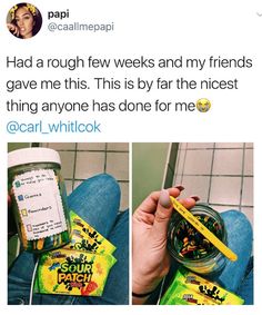 a person holding a jar of gummy bears with a yellow pencil in it and the caption reads, had rough few weeks and my friends gave me this