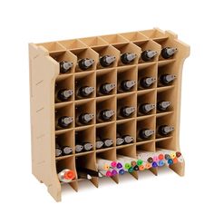 a wooden wine rack filled with lots of bottles