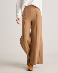 Our Ultra-Stretch Ponte Super Wide Leg Pants is the perfect combination of comfort and style for any occasion. Crafted from high-quality ponte fabric with an ultra-stretchy feel, these pants provide a flattering wide leg cut and an extra high-rise waistband for an elongating and chic fit while ensuring all-day comfort. Pair it with a blouse and heels for a sophisticated office look, or dress it down with a t-shirt and sneakers for a casual daytime look. Modern Full-length Business Casual Bottoms, Versatile Wide Leg Pants With Minimal Stretch, Full-length Elastane Bottoms For Business Casual, Business Casual Full-length Elastane Bottoms, Wide Leg Work Pants With Minimal Stretch, Versatile Wide-leg Elastane Pants, Wide Leg Pants With Minimal Stretch For Work, Chic Straight Pants With Comfort Stretch, Chic Full-length Wide Leg Elastane Pants